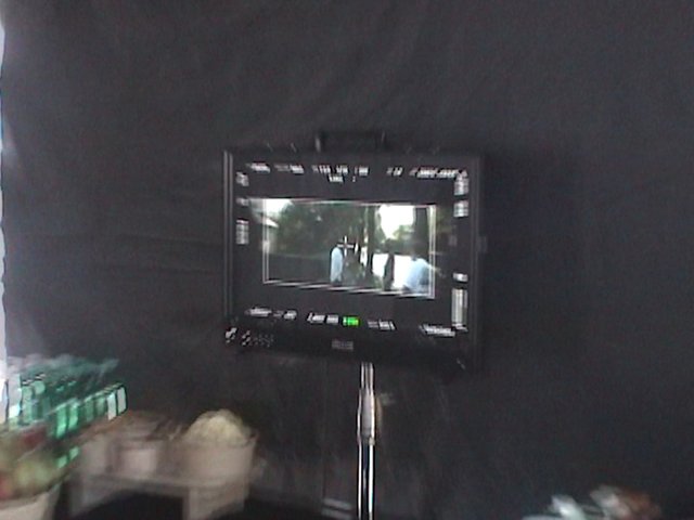 Video Reference: camera, monitor, viewfinder, filming, production, indoor, dark, equipment, screen, stand, outdoor scene, blurred, studio, video