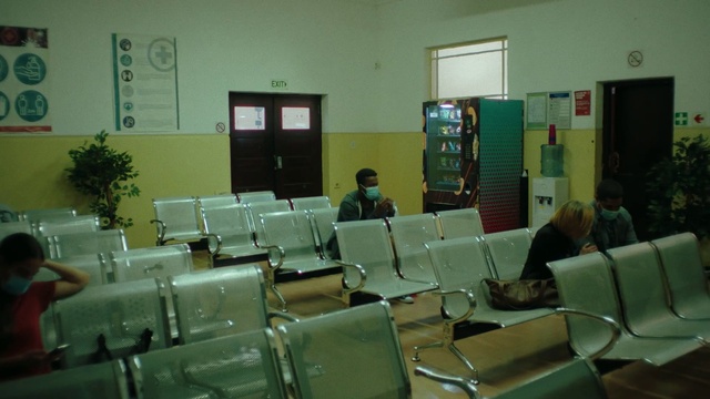 Video Reference: Chair, Interior design, Plant, Waiting room, Door, Event, Job, Room, Houseplant, Armrest