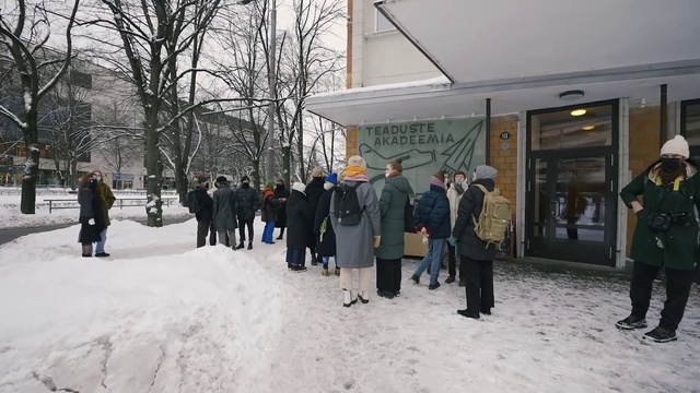Video Reference: Outerwear, Coat, Tree, Snow, Public space, Jacket, Building, City, Leisure, Freezing