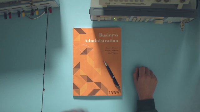 Video Reference: Orange, Triangle, Wood, Gesture, Line, Font, Art, Space, Thumb, Office supplies