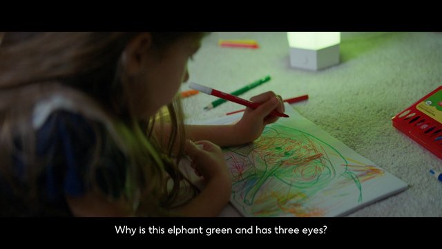 Video Reference: child, drawing, crayons, sketchbook, floor, carpet, art, coloring, pencil, elephant, picture, creative, indoor, caption, writing, play