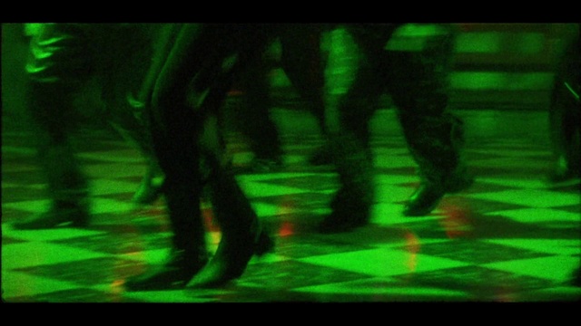 Video Reference: Green, Font, Tints and shades, Flooring, Entertainment, Electronic device, Human leg, Display device, Thigh, Art