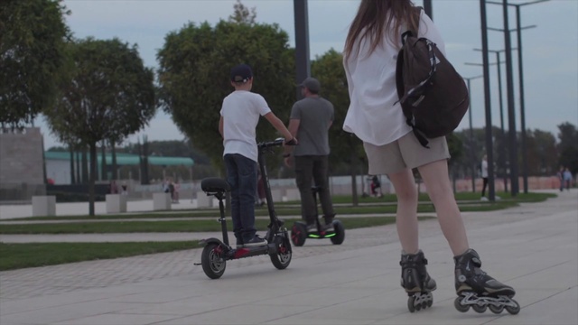 Video Reference: Wheel, Tire, Photograph, Sky, Tree, Rolling, Sports equipment, Asphalt, Leisure, Roller sport