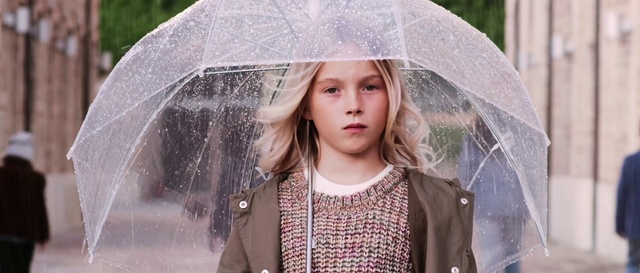 Video Reference: Hair, Lip, Outerwear, Hairstyle, Photograph, Facial expression, White, Umbrella, Light, Street fashion