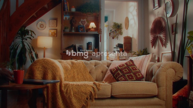 Video Reference: Brown, Furniture, Property, Picture frame, Building, Couch, Comfort, Azure, Wood, Orange