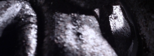 Video Reference: Grey, Automotive tire, Tints and shades, Road surface, Asphalt, Font, Monochrome photography, Tree, Darkness, Pattern