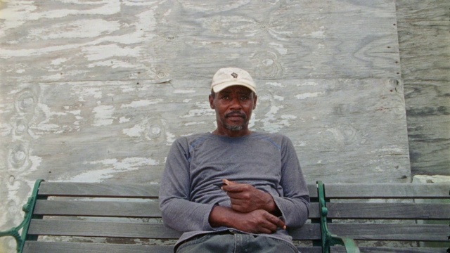 Video Reference: Cap, Sleeve, Baseball cap, T-shirt, Wood, Leisure, Comfort, Sitting, Travel, Elbow