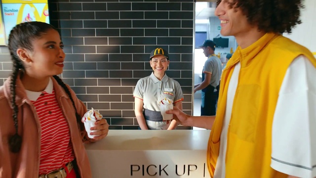 Video Reference: Smile, Sleeve, Yellow, Baseball cap, Community, Cap, T-shirt, Engineering, Event, Job