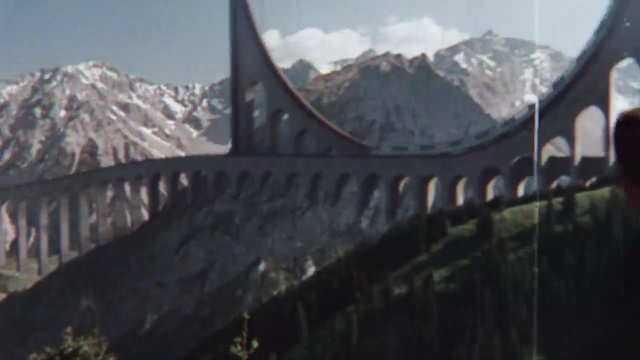 Video Reference: Sky, Mountain, Snow, Cloud, Mountain range, Mountainous landforms, Landscape, Natural landscape, Bridge, Winter