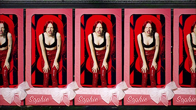 Video Reference: Rectangle, Textile, Sleeve, Font, Red, Magenta, Fashion design, Art, Event, Pattern