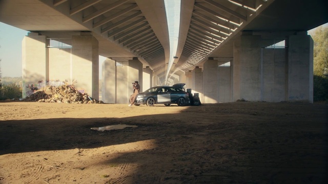 Video Reference: Tire, Car, Wheel, Building, Automotive lighting, Vehicle, Automotive design, Shade, Road surface, Asphalt