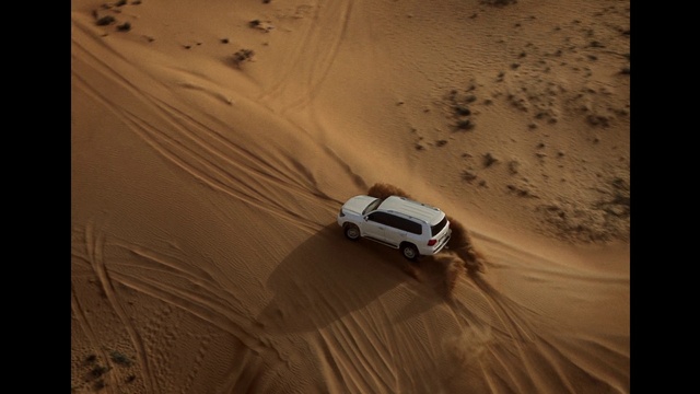Video Reference: Land vehicle, Car, Vehicle, Ecoregion, Wheel, Automotive design, Tire, Motor vehicle, Erg, Landscape