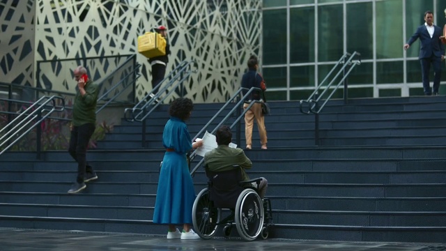 Video Reference: Wheel, Tire, Wheelchair, Rolling, Building, Bicycle wheel, Recreation, Road, Sitting, Street