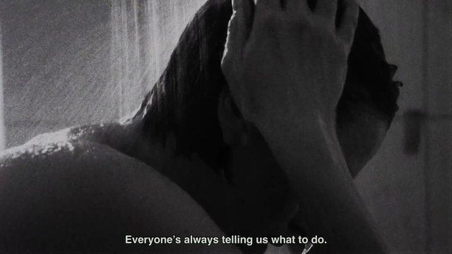 Video Reference: black and white, close up, people, intimate, silhouette, portrait, subtitled, film frame, moody, low light, grayscale, video still