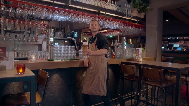 Video Reference: Drinking establishment, Barware, Bottle, Alcoholic beverage, Table, Bar stool, Drink, Beer tap, Drinkware, Customer