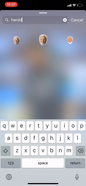 Video Reference: smartphone, search, keyboard, typing, app interface, blurred background, emoji, face icons, mobile screen, text entry, iPhone, UI