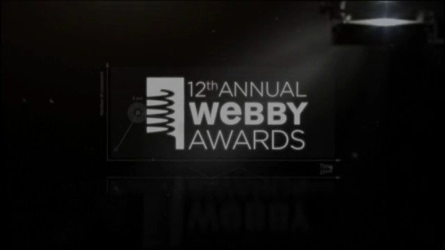 Video Reference: award, ceremony, stage, screen, logo, event, presentation, dark, text, webby, awards, conference