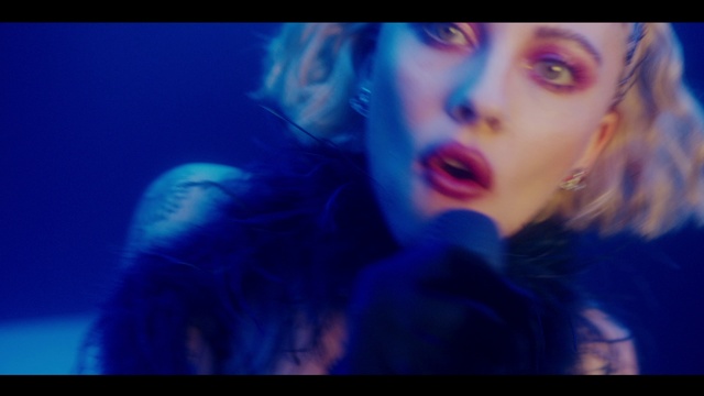 Video Reference: Lip, Eyelash, Jaw, Purple, Gesture, Flash photography, Violet, Music, Music artist, Entertainment