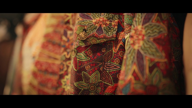 Video Reference: Sleeve, Organism, Art, Tints and shades, Motif, Pattern, Font, Human leg, Magenta, Chest