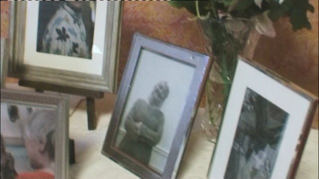 Video Reference: framed photos, photo display, tabletop, portrait, floral art, picture frames, indoor, decor, vase, flowers, home interior, arrangement