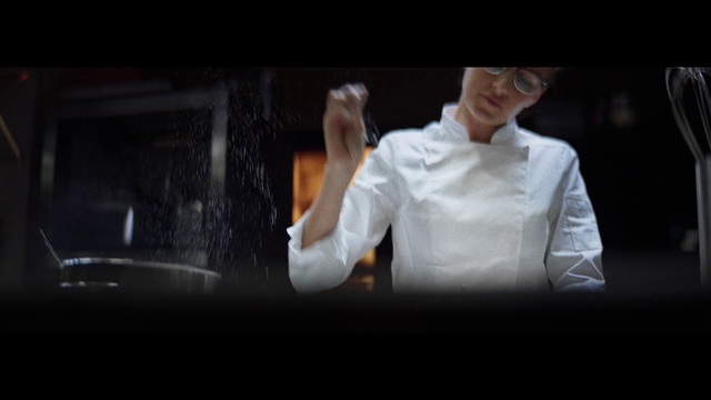 Video Reference: Flash photography, Sleeve, Gesture, Automotive design, Chefs uniform, Font, Formal wear, Event, Entertainment, Darkness