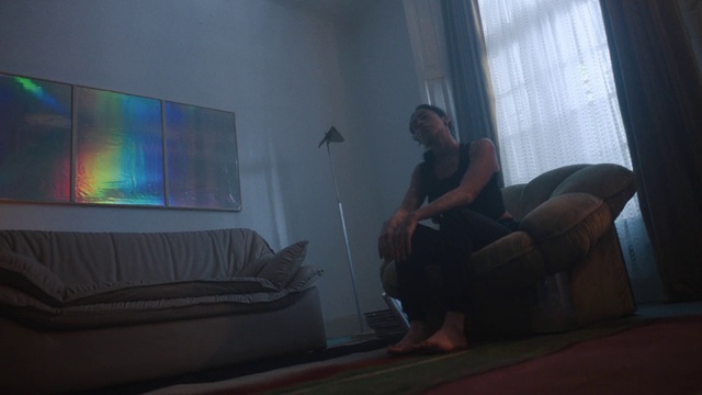 Video Reference: Couch, Comfort, Living room, Grey, Floor, Line, Flooring, Knee, Wood, Tints and shades