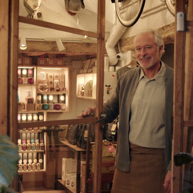 Video Reference: Drinking establishment, Wood, Barware, Picture frame, Smile, Shelf, Eyewear, Customer, Window, Shelving