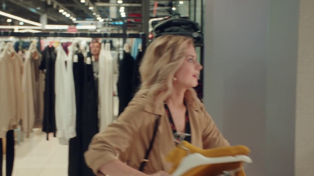Video Reference: Sleeve, Clothes hanger, Fashion design, Event, Sportswear, Retail, Eyewear, Customer, Bag, Room