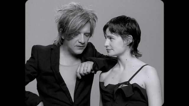 Video Reference: Hair, Lip, Hairstyle, Black, Eyelash, Flash photography, Gesture, Black-and-white, Style, Happy