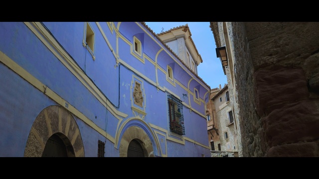 Video Reference: Window, Building, Sky, House, Facade, Tints and shades, Symmetry, Font, Electric blue, City