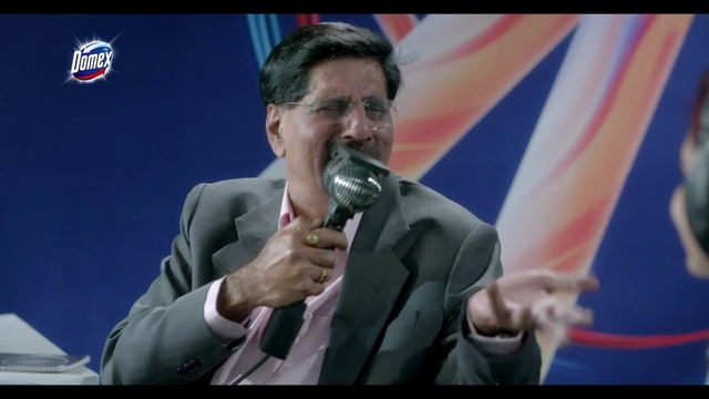 Video Reference: Microphone, Coat, Gesture, Public address system, Spokesperson, Music artist, Blazer, Audio equipment, Suit, News