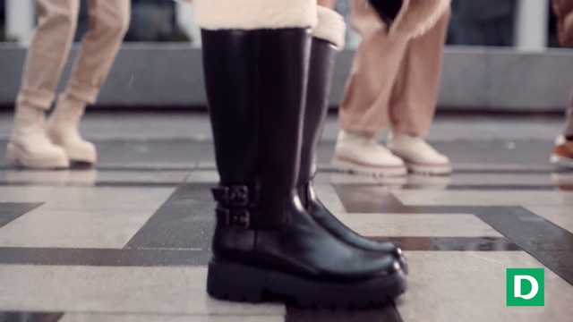 Video Reference: Shoe, White, Black, Flooring, Human leg, Event, Fashion accessory, Logo, Calf, Pedestrian