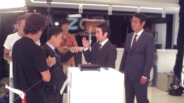 Video Reference: Gesture, Automotive design, Suit, Blazer, White-collar worker, Event, Customer, Formal wear, Engineering, Job