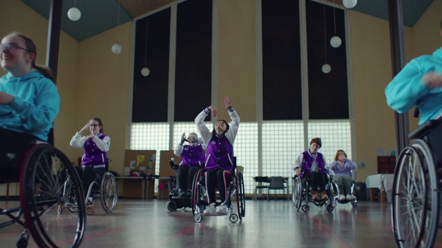 Video Reference: Wheel, Wheelchair, Tire, Chair, Purple, Wheelchair sports, Social group, Leisure, Sports, Competition event
