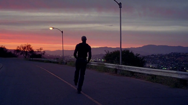Video Reference: Cloud, Sky, Plant, Street light, Road surface, Asphalt, Sunlight, Dusk, Atmospheric phenomenon, Tree