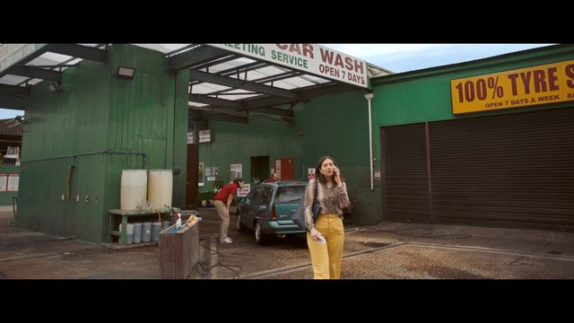 Video Reference: car wash, auto service, woman, worker, car, shop exterior, urban, business, street, daytime, parking, service station, tyre shop