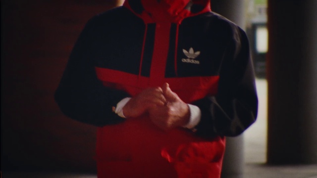 Video Reference: Outerwear, Sleeve, Gesture, Collar, T-shirt, Event, Elbow, Magenta, Wrist, Electric blue