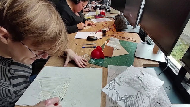 Video Reference: Hand, Table, Photograph, Desk, Eyewear, Automotive design, Chair, Writing implement, Artist, Art