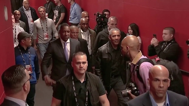 Video Reference: Outerwear, Shirt, Coat, Tie, Suit, Crowd, Blazer, Event, T-shirt, Formal wear