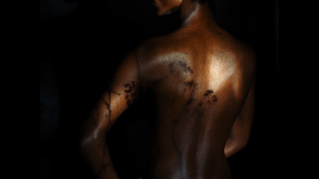 Video Reference: shirtless, back view, tattoo, person, dark background, low light, dramatic lighting, rear view, torso, skin, male