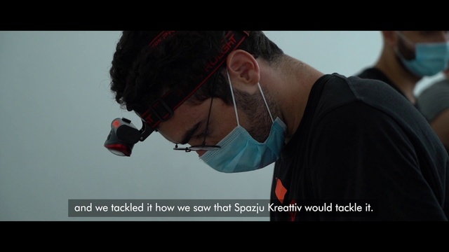 Video Reference: Glasses, Vision care, Neck, Sleeve, Flash photography, Gesture, Eyewear, Audio equipment, Elbow, Font