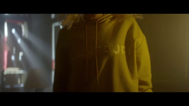 Video Reference: Sleeve, Gesture, Font, Beard, Chest, T-shirt, Event, Electric blue, Fashion design, Darkness