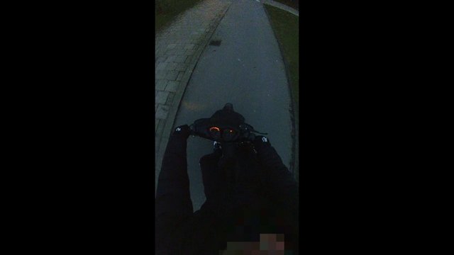 Video Reference: night, POV, cycling, bicycle, scooter, sidewalk, road, urban, motion, dark, outdoor, transportation