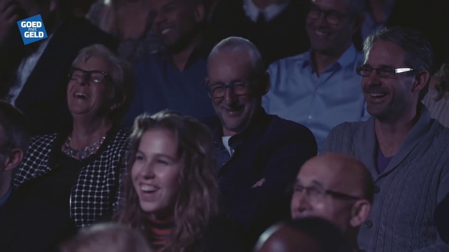 Video Reference: Face, Glasses, Smile, Head, Vision care, Organ, Purple, Eyewear, Social group, Crowd