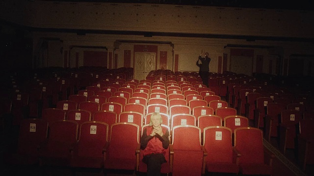 Video Reference: Entertainment, Performing arts, Event, Darkness, Font, Crowd, Stage, Musical instrument accessory, Music venue, Audience