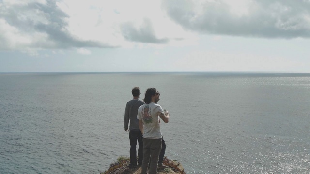 Video Reference: Cloud, Water, Sky, People in nature, Gesture, Coastal and oceanic landforms, Travel, Terrain, Lake, Horizon