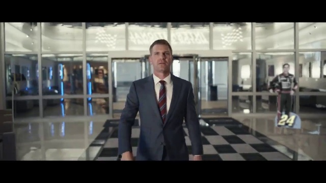 Video Reference: Dress shirt, Sleeve, Tie, Flash photography, Automotive design, Collar, Suit, Blazer, Flooring, Fashion design