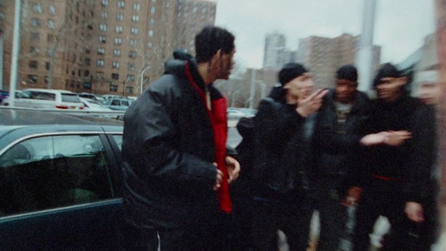 Video Reference: Building, Gesture, Sky, Vehicle, Motor vehicle, Car, Event, City, Winter, Luxury vehicle