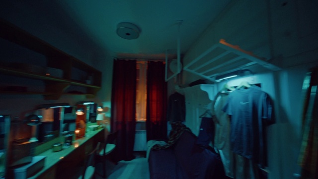 Video Reference: Azure, Sleeve, Aqua, Electric blue, Space, Darkness, Room, Event, Clothes hanger, Service