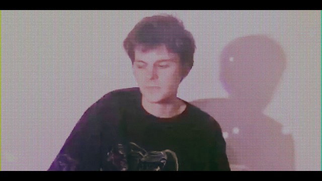 Video Reference: Sleeve, Font, Art, T-shirt, Magenta, Tints and shades, Music, Pattern, Display device, Sportswear